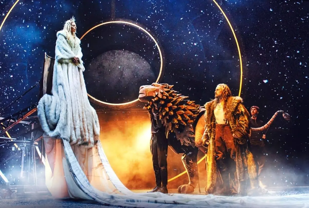 The witch looking down at the lion and Tumnus