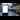 Trains in the UK: A blank digital billboard at a train station with many passengers walking by in the distance.