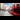 A view down Oxford Street with a red double-decker bus passing by.