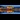 A panoramic shot of an illuminated Colwyn Castle in the evening